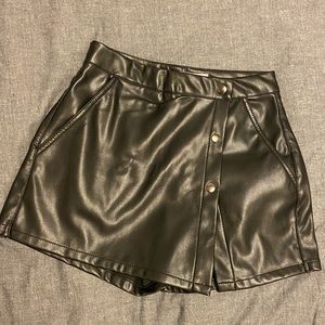 Black faux leather skort.